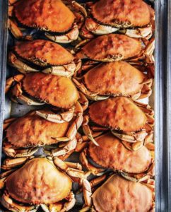 A container full of Dungeness crabs