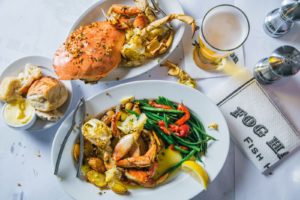 An overhead look at cooked crab on two plates 